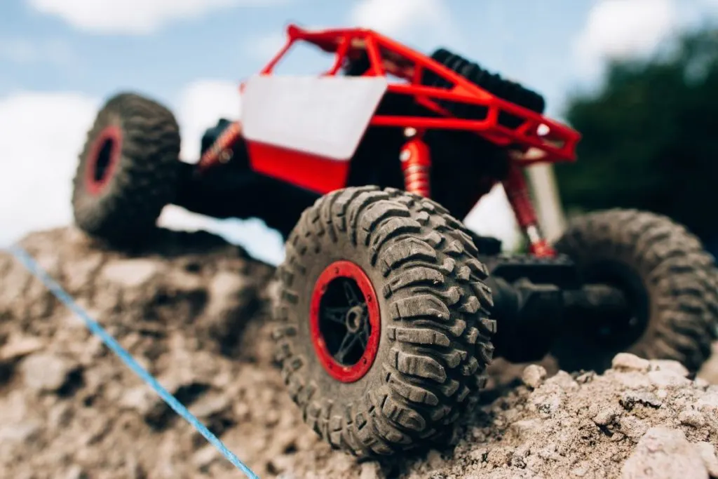 RC rock crawler going up a hill